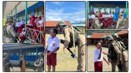 Personel Satgas Ops Damai Cartenz berinteraksi dengan siswa SDN Bale saat patroli dialogis di Distrik Kabiding, Pegunungan Bintang. (Dok_NT.ODC)