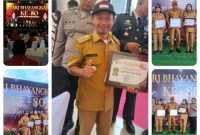 Kapolda Papua Tengah Brigjen Pol. Jermias Rontini menyerahkan Piagam Kampung Kamtibmas kepada Kepala Kampung Lagari Jaya, Abdul Ghofur, pada puncak peringatan Hari Bhayangkara ke-80 di Nabire. Dok_Andi NT